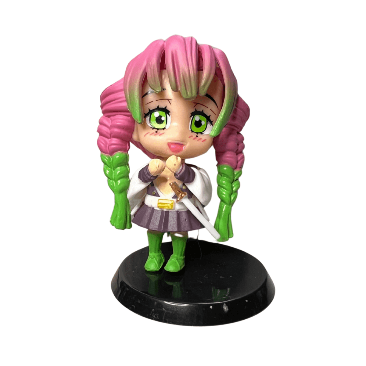 Anime collectible toy of Mitsuri Kanroji from Demon Slayer, chibi style figure with vibrant outfit.